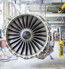 Image showing a jet engine with a control pendant being repaired.