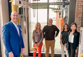 Image of group of people smiling at the camera