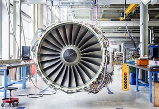 Image showing a jet engine with a control pendant being repaired.