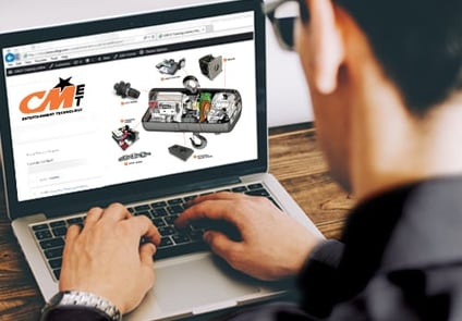 Image of man on computer taking CM online training course