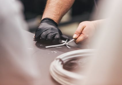 Image of person holding a wire rope
