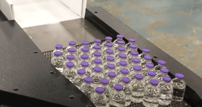 Image of Conveyor moving pharmaceutical product down line